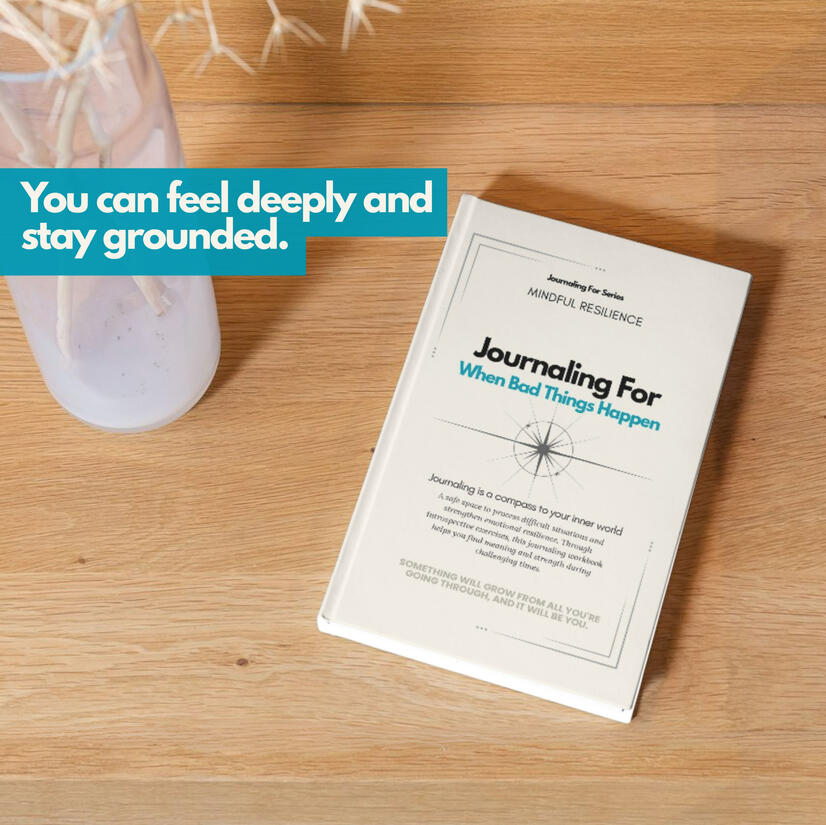 Untitled Journaling For – When Bad Things Happen’ workbook placed on a wooden surface beside a translucent vase, representing the Mindful Resilience series.