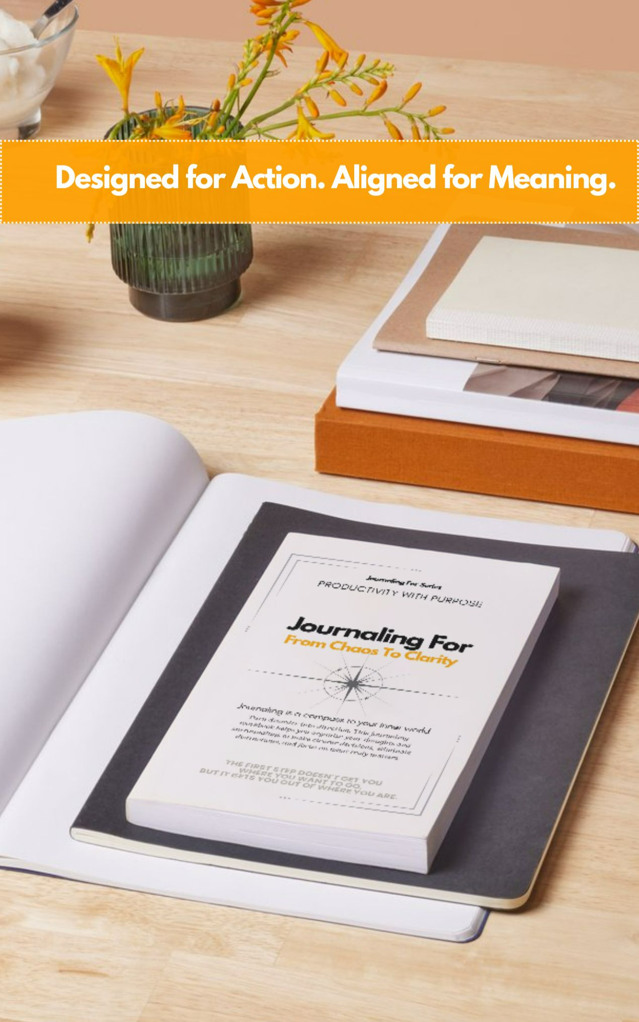 Journaling For – From Chaos to Clarity workbook on a minimalist desk with a yellow flower arrangement, representing the Productivity With Purpose category