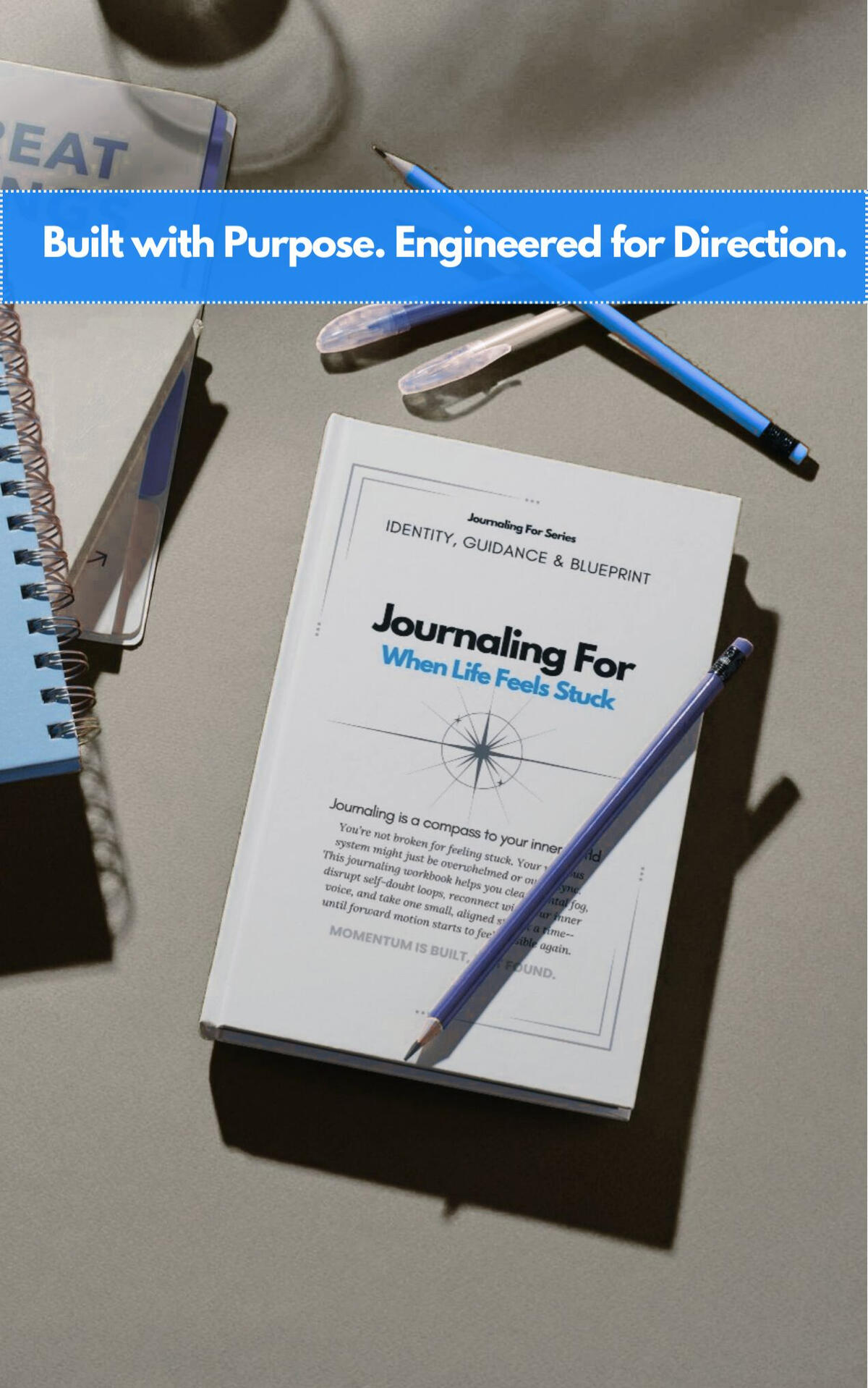 Journaling For – When Life Feels Stuck workbook styled with drafting tools on a grey surface, representing the Identity, Guidance & Blueprint category